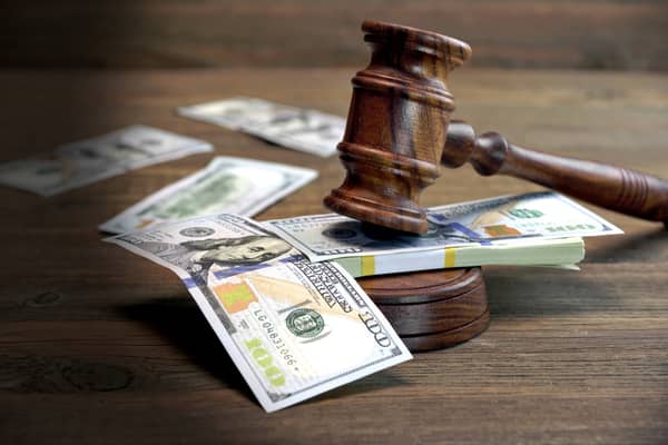 money and judge gavel punitive damages against corporate defendants