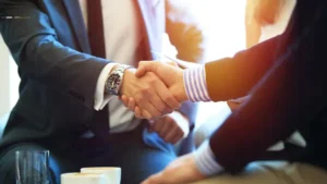 Los Angeles personal injury appeals lawyer shaking hands with client after winning a case