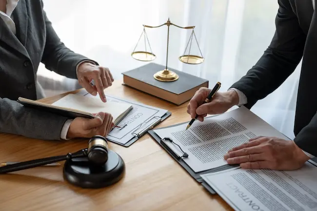 Appellate attorneys discussing documents